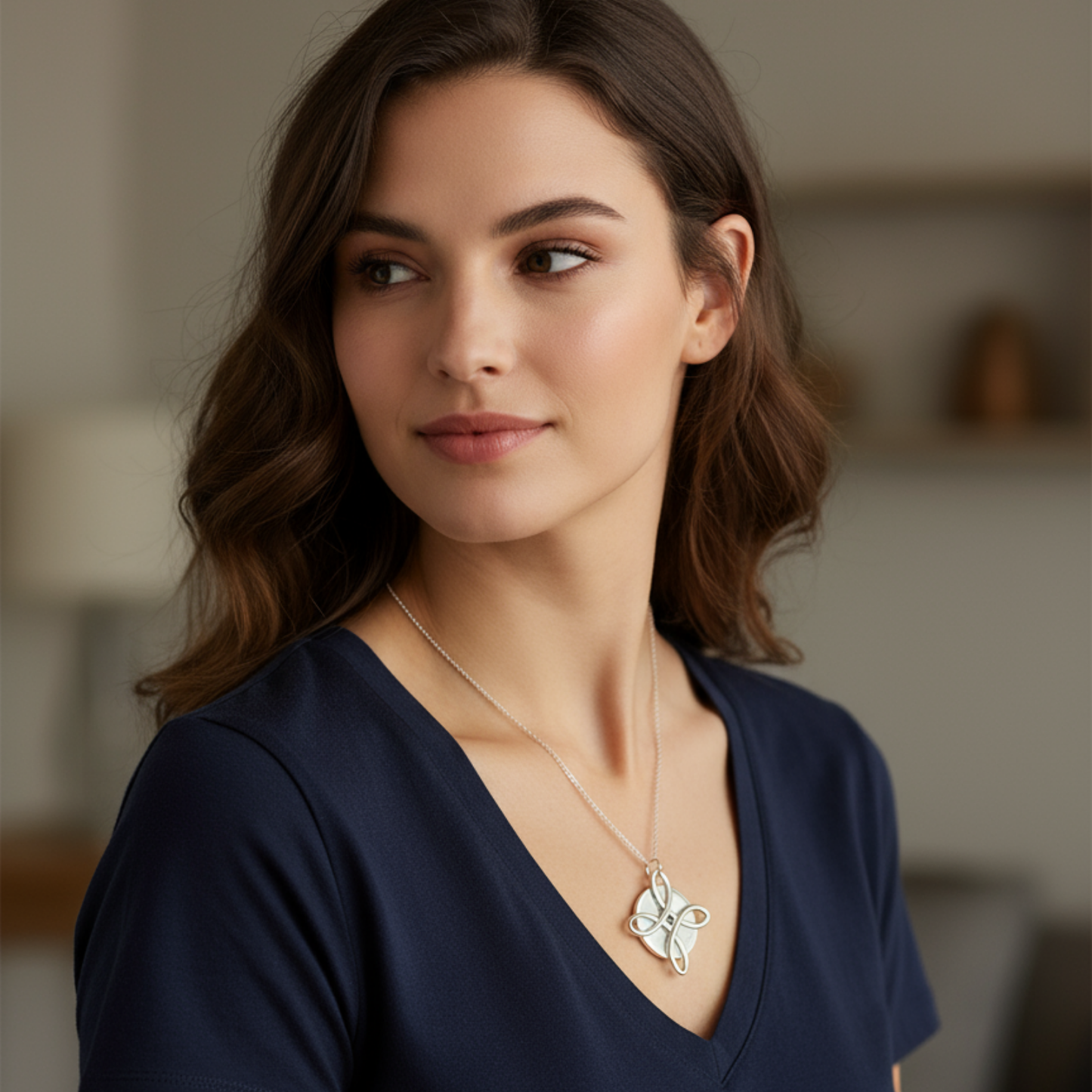 Woman wearing an Areca Plus Necklace in an indoor setting